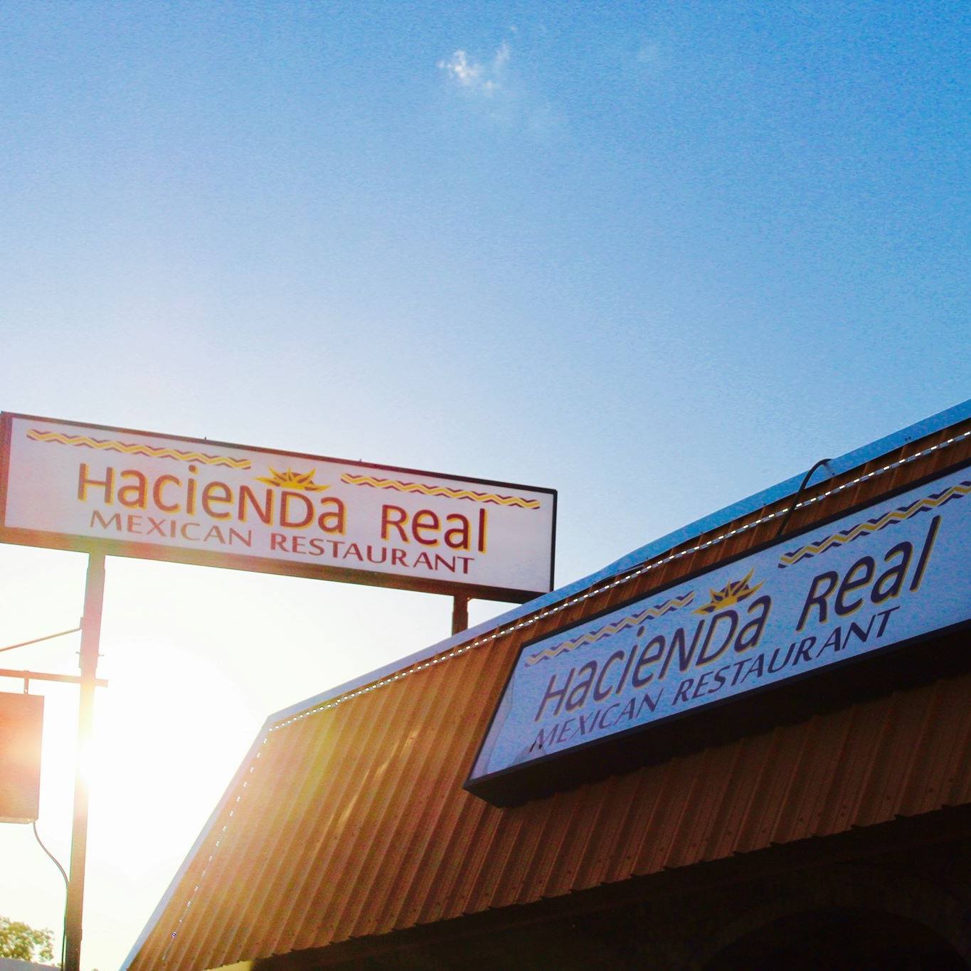 Hacienda Real Mexican Restaurant illuminated signage at sunset