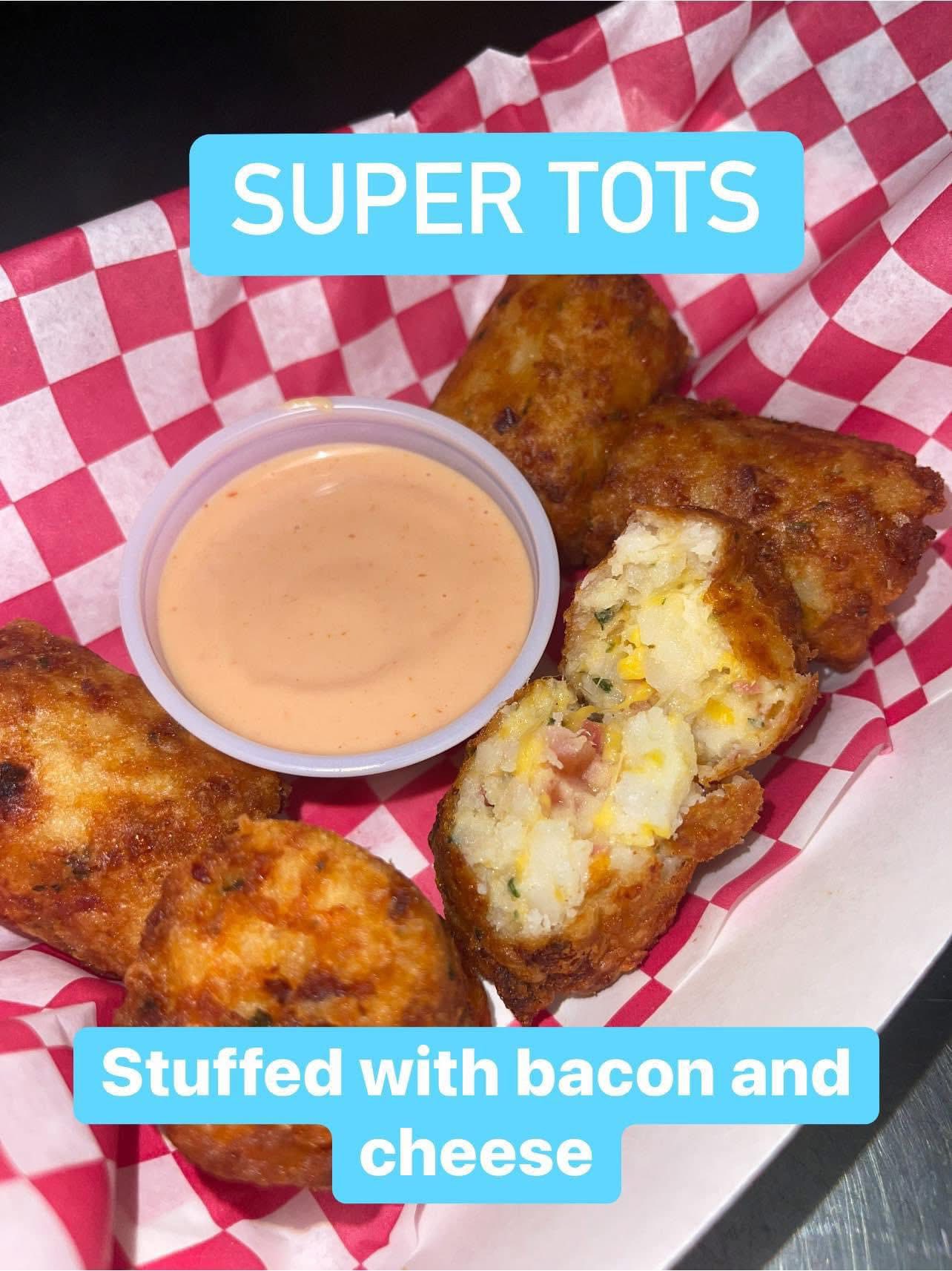 Super Tots — fried potato bites stuffed with bacon and cheese, with dipping sauce