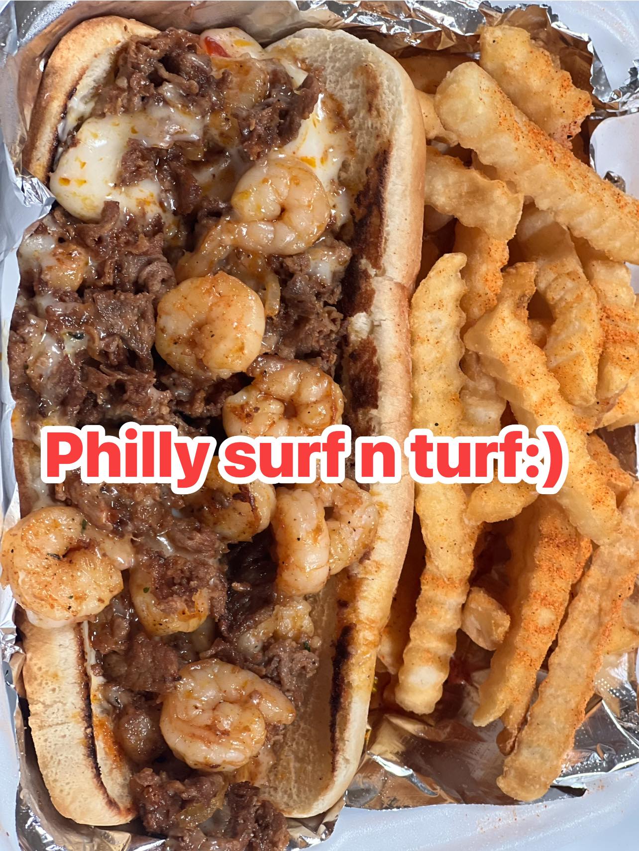 Philly surf and turf po'boys loaded with steak and shrimp, with crinkle fries